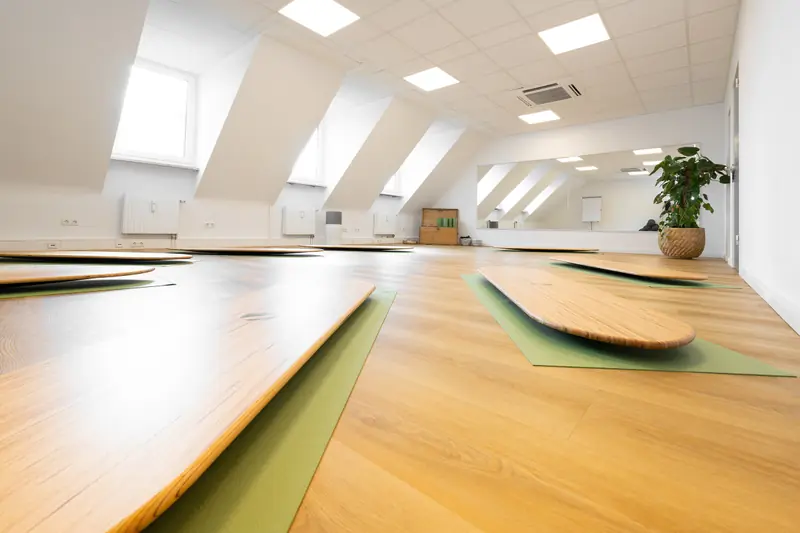 Large course room with wooden floor and skylights